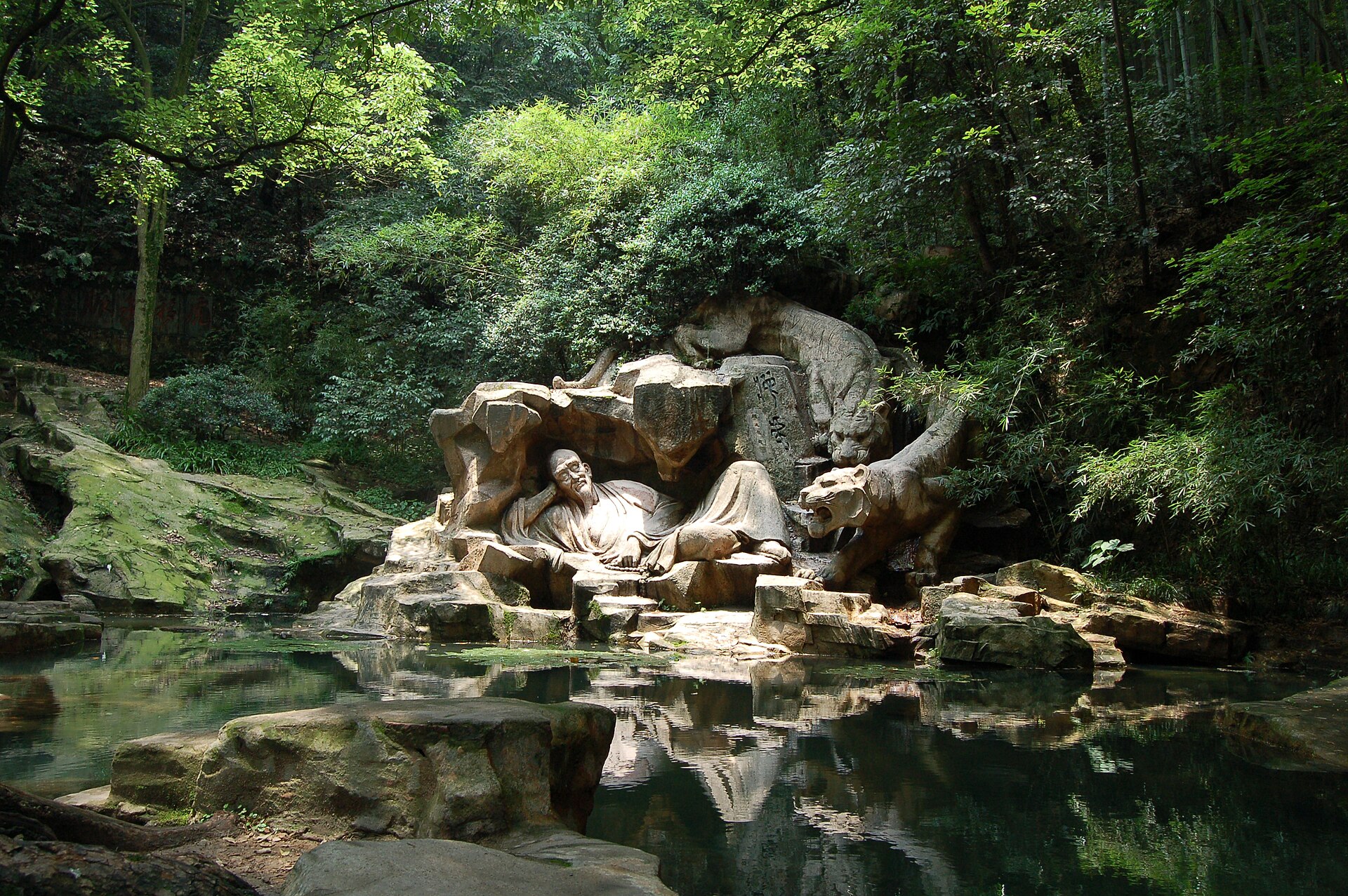 Stone spring pool and greenery at Hupao Spring in Hangzhou